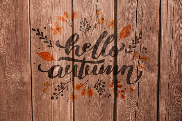 Hello Autumn Written On A Wooden Background Psd
