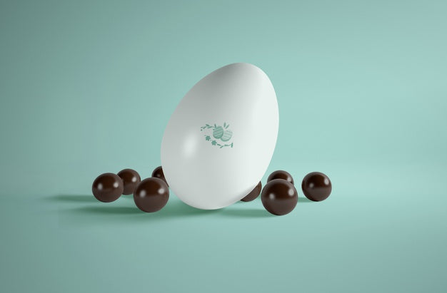 High Angle Big Egg With Small Chocolate Eggs Beside Psd