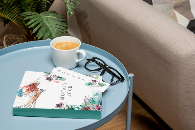 High Angle Book Mock-Up On Coffee Table With Glasses Psd