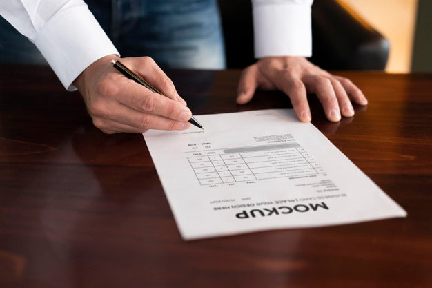 High Angle Business Man Writing On Paper Mock-Up Psd