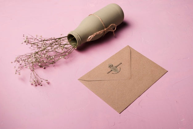 High Angle Envelope And Vase Arrangement Psd