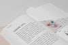 High Angle Floral Bookmark And Open Book Mock-Up Psd