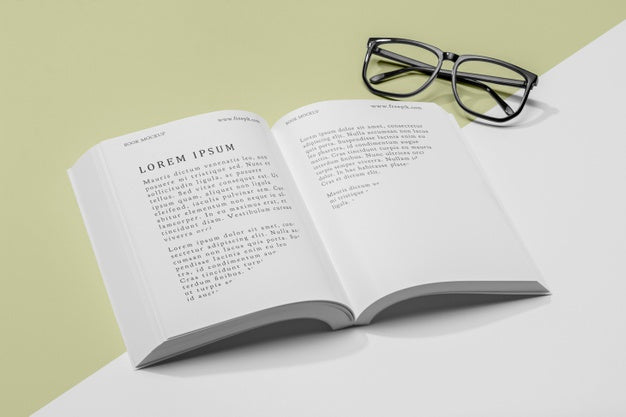 High Angle Glasses And Open Book Mock-Up Psd