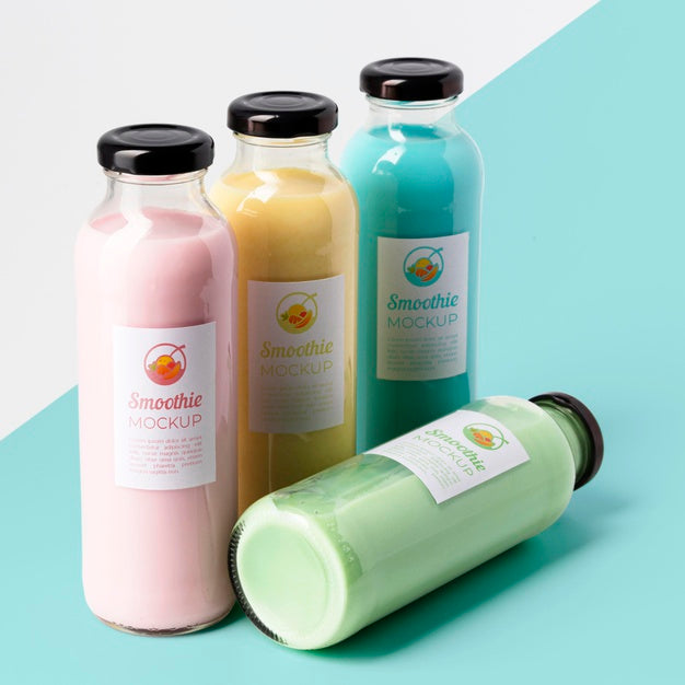 High Angle Of Assortment Of Clear Juice Bottles With Caps Psd