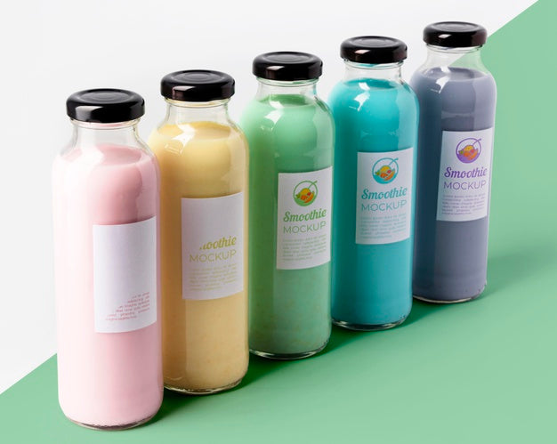 High Angle Of Assortment Of Juice Glass Bottles Psd