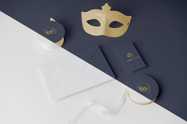High Angle Of Carnival Invitation In Envelope With Tape And Mask Psd