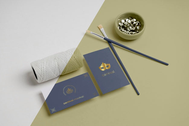 High Angle Of Carnival Invitation With Paint Brushes And Thread Psd