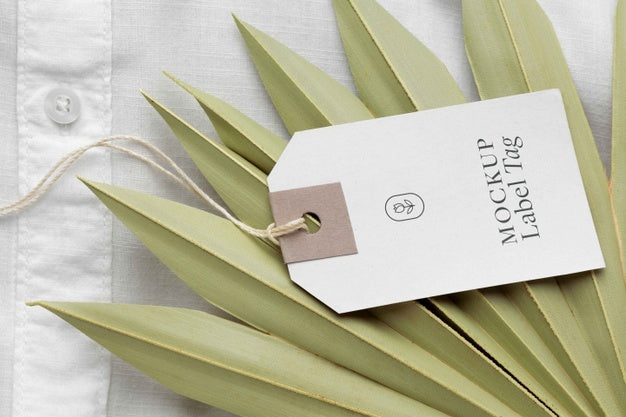 High Angle Of Clothing Label Mock-Up On White Shirt Textile Psd