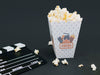 High Angle Of Cup With Popcorn And Cinema Clapperboard Psd
