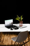 High Angle Of Desk With Laptop And Plant Psd