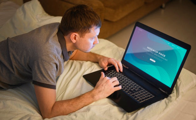 High Angle Of Man Working On Laptop From Home Psd