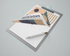 High Angle Of Notepad Mock-Up With Geometric Design And Pen Psd