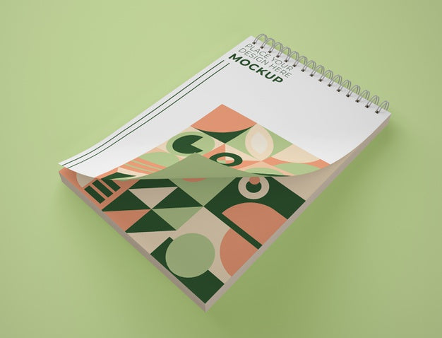 High Angle Of Notepad Mock-Up With Geometric Design Psd