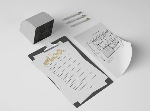 High Angle Of Notepad With Papers And Plan Psd