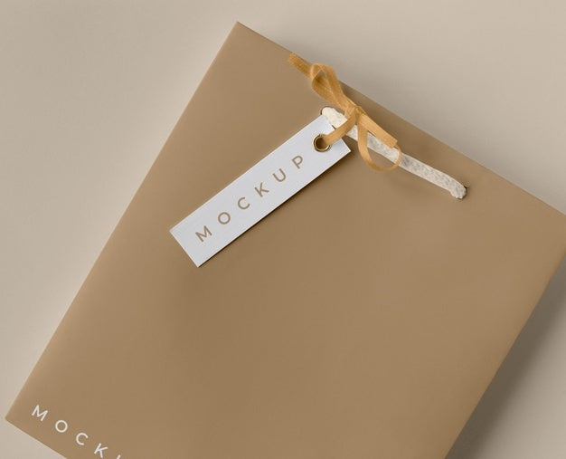 High Angle Of Paper Shopping Bag Mock-Up With Paper Tag Psd