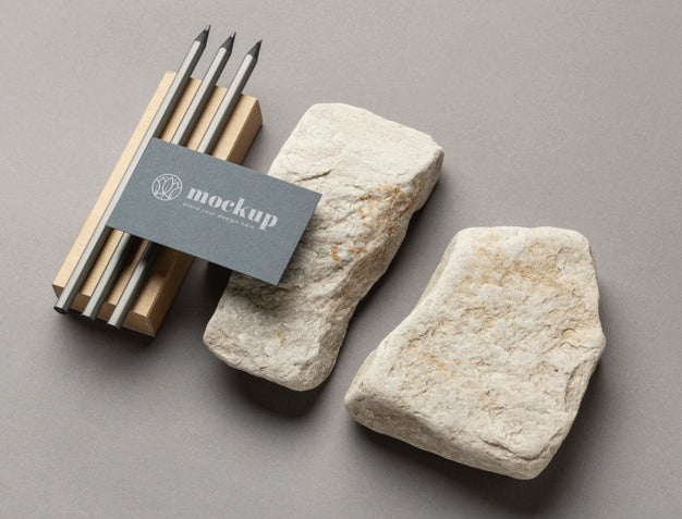 High Angle Of Paper Stationery With Stones And Pencils Psd
