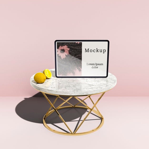 High Angle Of Tablet On Table With Lemons Psd