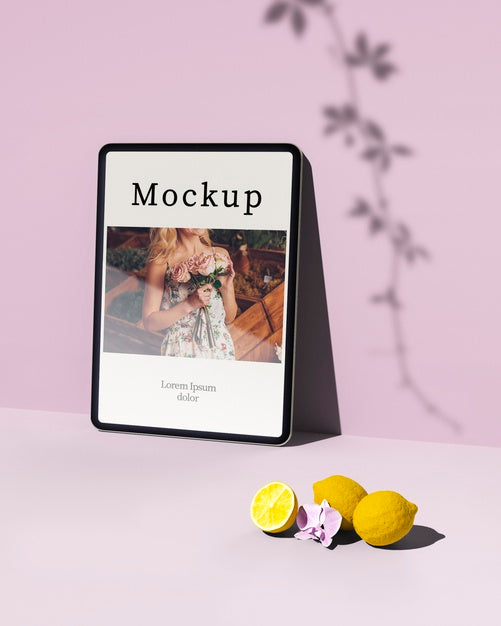 High Angle Of Tablet With Photo And Citrus Psd