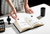 High Angle Of Woman Using Book At Desk Psd