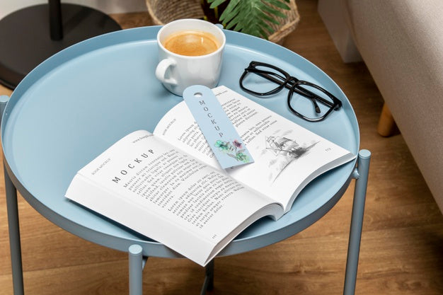 High Angle Open Book Mock-Up On Coffee Table With Bookmark Psd