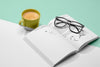 High Angle Open Book Mock-Up With Coffee And Glasses Psd