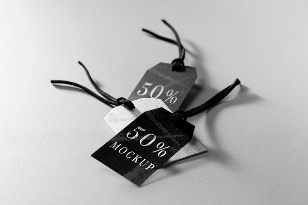 High View Mock-Up Arrangement Of Black And White Clothing Tags Psd