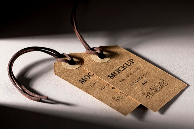 High View Mock-Up Arrangement Of Cardboard Clothing Tags Psd