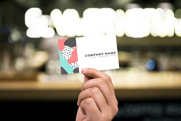 Holding Up A Business Card Mockup Psd