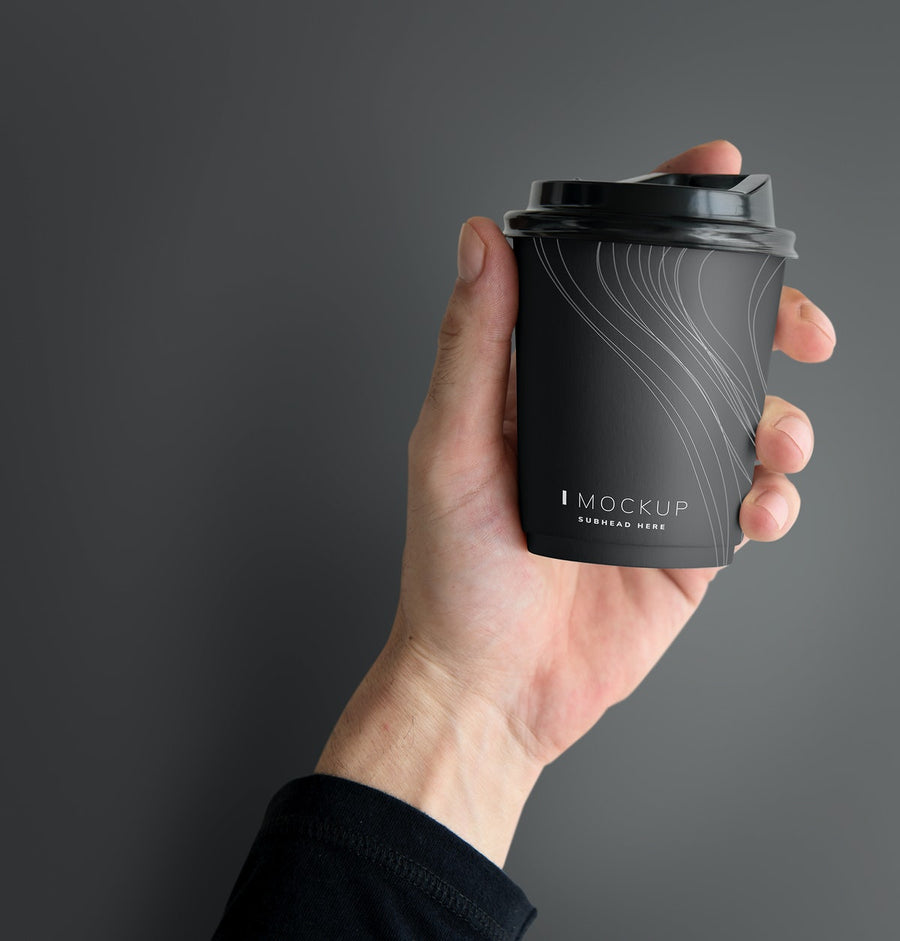 Human Hand Holding A Mockup Coffee Cup