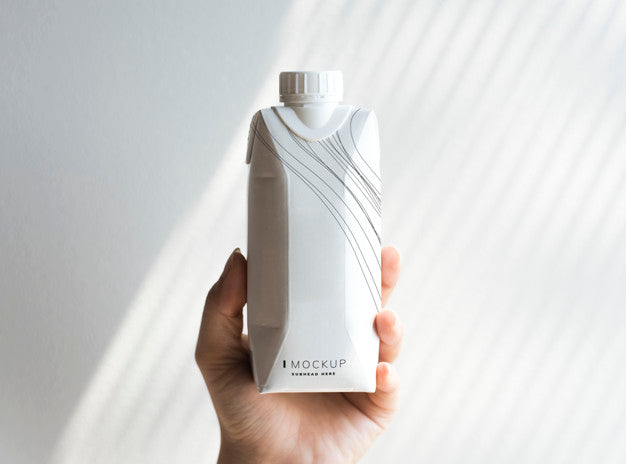 Human Hand Holding Paper Bottle Mockup Psd