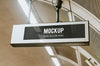 Indoor Board Mockup Hanging From A Ceiling Psd