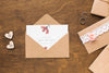 Invitation Mock-Up And Wedding Rings On Wooden Background Psd