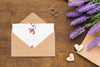 Invitation Mock-Up And Wedding Rings With Lavender Psd