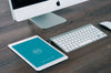 Apple iPad Mockup on Office Desk with iMac