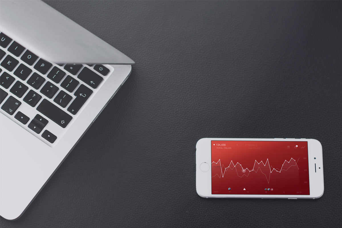 iPhone Mockup And Macbook On A Leather Background
