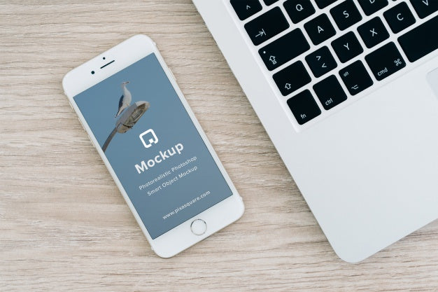 White iPhone 7 on Office with Empty Screen PSD Mockup