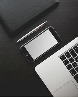 Iphone On A Black Wood Table