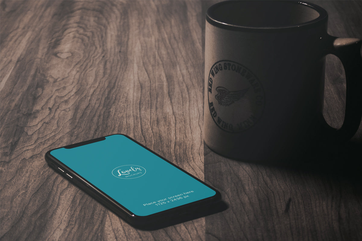 iPhone X Mockup On A Vintage Wooden Table