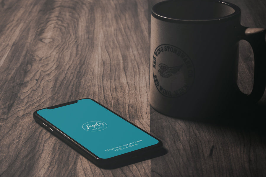 iPhone X Mockup On A Vintage Wooden Table