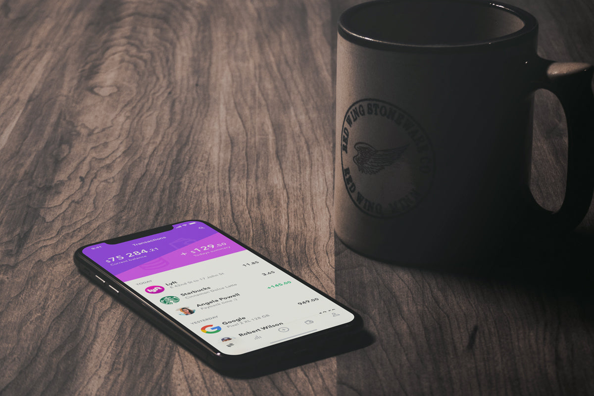 iPhone X Mockup On A Vintage Wooden Table