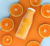 Isolated Bottle Of Fruit Juice And Slices Of Orange Psd