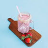 Jar Mockup With Pink Yogurt And Strawberries Psd