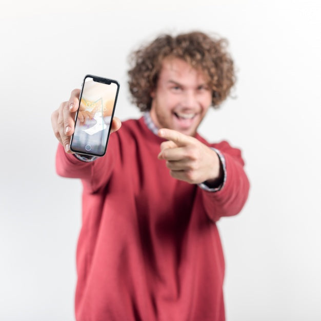 Joyful Man Holding Smartphone Mockup Psd
