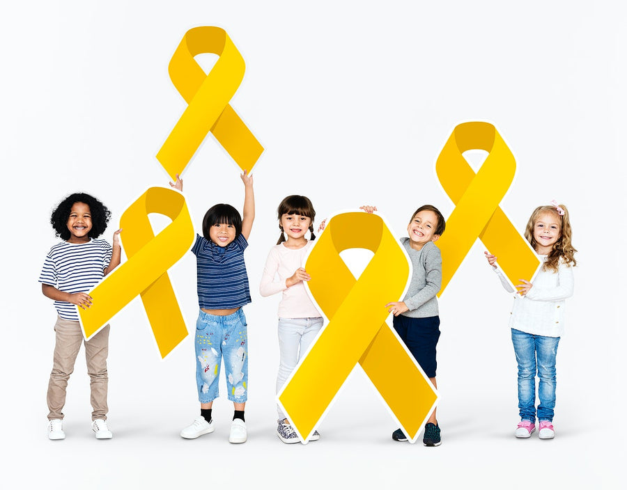 Kids Holding Gold Ribbons Supporting Childhood Cancer Awareness