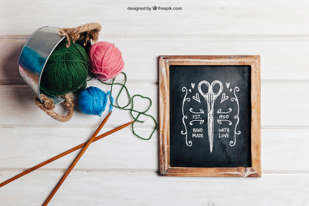 Knitting Concept With Slate And Metal Pot Psd