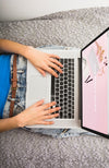 Laptop Mockup On Bed With Hands Psd
