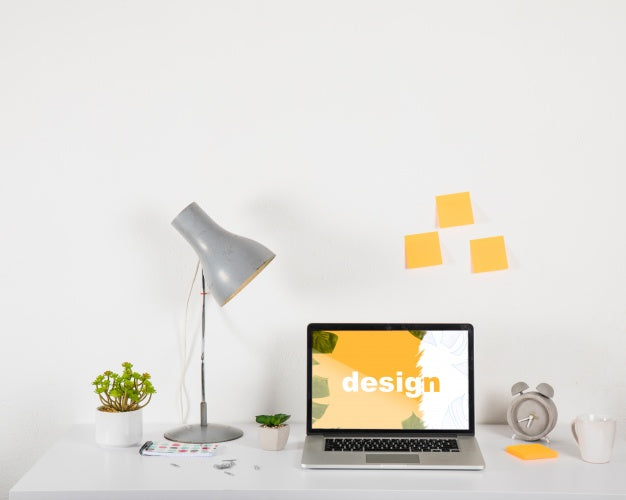 Laptop Mockup On Desk With Elements Psd