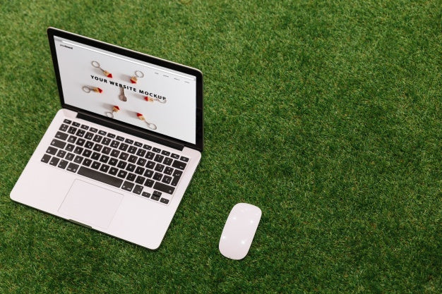Laptop Mockup On Grass Psd