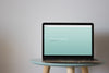 Laptop Mockup On Round Table Psd