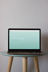 Laptop Mockup On Round Table Psd